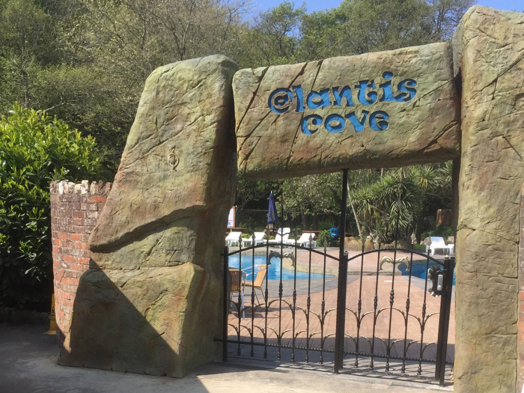Entrance stone arch and gate to atlantis cove