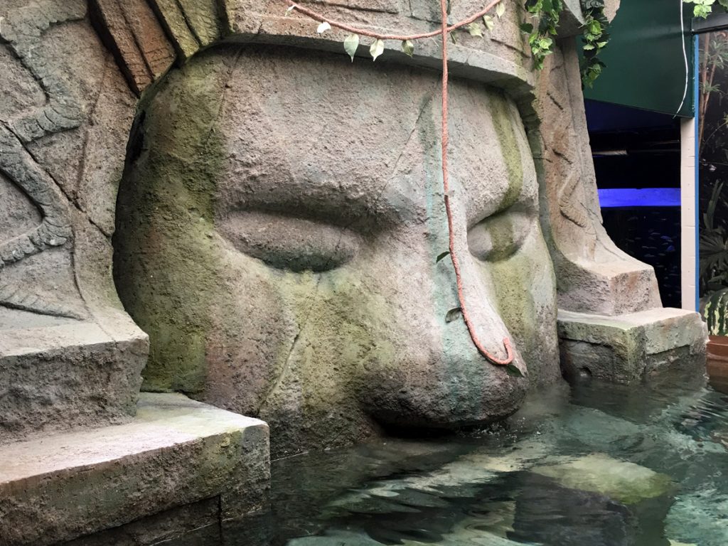 Theme park model of a giant stone face carving